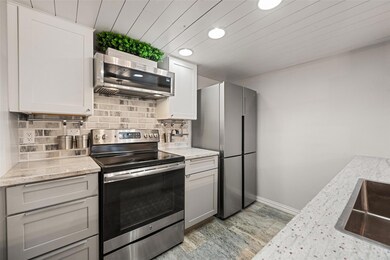 Kitchen with sink, appliances with stainless steel