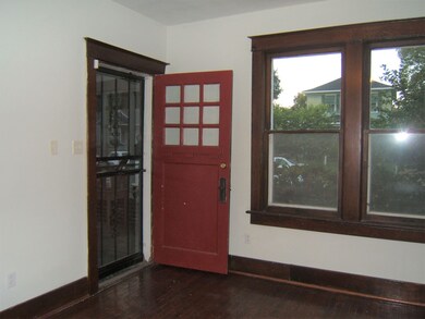 Inviting 15x12 living room with fireplace. Wood fl