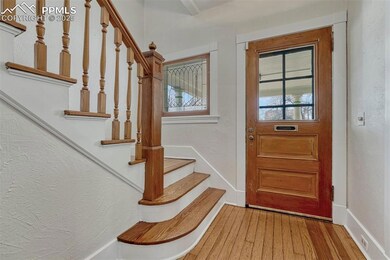 Original leaded glass windows and staircase