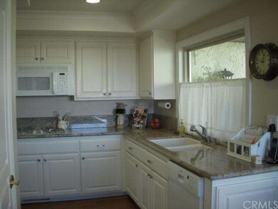 Remodeled sunny kitchen with pull-out cabinets, pa