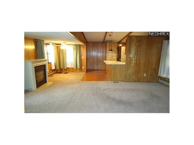 Spacious living room with gas fireplace.  Dining a