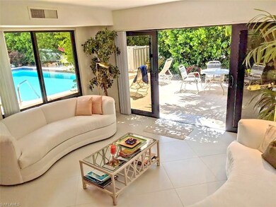 10th Ave S Naples - living room - view to the pool