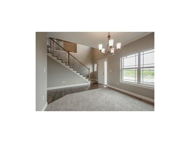 Living room that is located by the front foyer of 