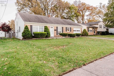 Central air, living room w/fireplace, brick and vinyl sided.