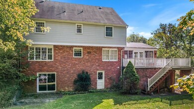 Rear of the home boasts a walk-out basement and de