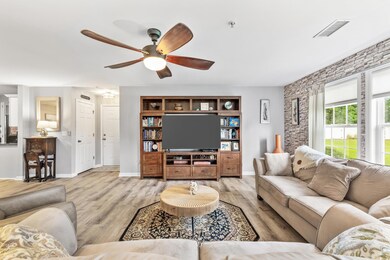 Living room featuring light wood-type flooring, an