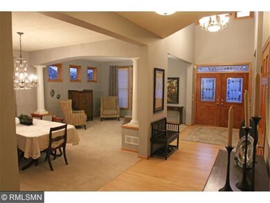 Impressive two story foyer is open to the living r