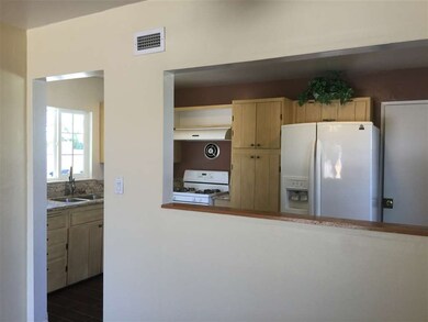 Cutaway allows views from kitchen to the dining ro