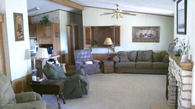 Great room, kitchen left..wet bar at end