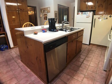 Island, dishwasher, tile flooring
