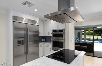 Kitchen featuring visible vents, stainless steel a