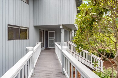 The breezeway to the front door is easily accessible with just one step. The breezeway is scheduled for updates and new support poles in Sept., 2025, to insure lasting quality and safety.