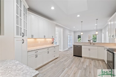 Kitchen w/Stainless Steel Appliances, White Shaker