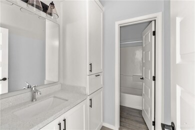 Bathroom featuring vanity and wood finished floors
