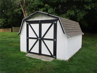View of outdoor structure with a storage unit and 