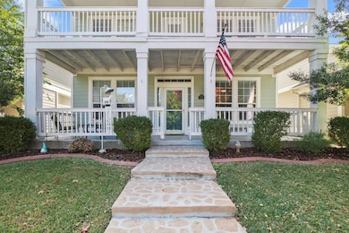 Property entrance with a yard and covered porch