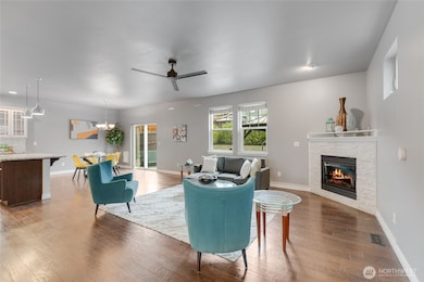 Great room design with corner gas fireplace.