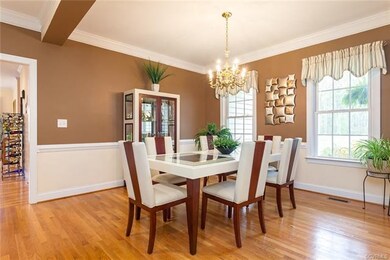 Dining room opens to foyer and living rooom (or library) via columns. You will love hosting your dinner parties here!
