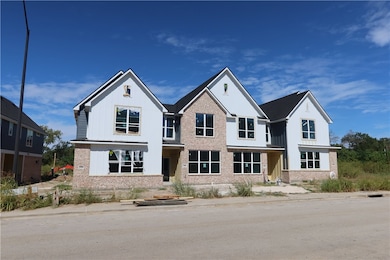 Modern farmhouse with board and batten siding and brick siding