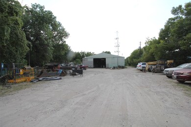 Warehouse entrance at 13729 Luthe Rd - Stabilized area in front and around building