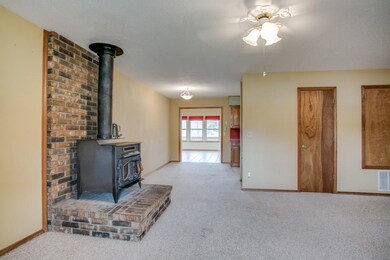 Dining area off kitchen opens to den/sunroom.