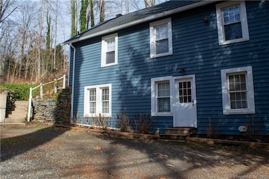 Quiet setting with a private entrance to the first floor unit (1) and exterior stairs to upper level unit.