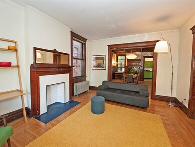 The living room is open to the foyer and dining ro