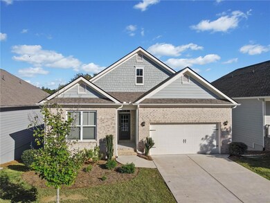 Craftsman-style house with a front yard and a gara