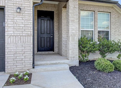 Property entrance with brick siding