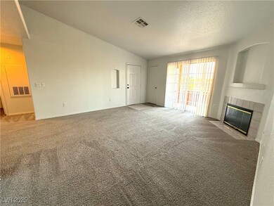 Unfurnished living room with carpet flooring, a fi