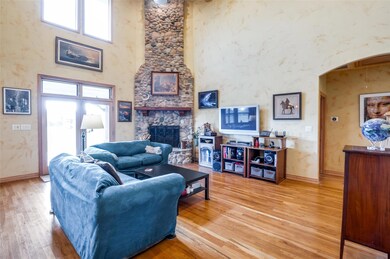 Living room featuring 2 story  ceiling, with trans