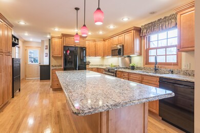 LARGE ISLAND will accommodate several stools.