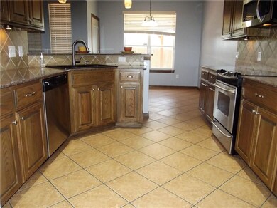 Newly painted kitchen and dining featuring granite