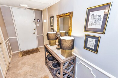 The hallway entry of the residence features muted