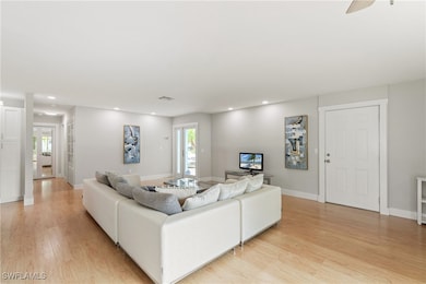 Living room with light wood-type flooring