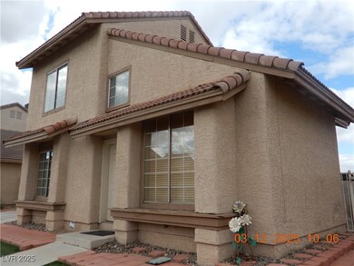 View of side of home featuring stucco siding and a