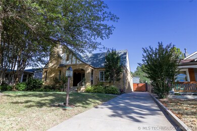 Front of home with Driveway & Gated Garage