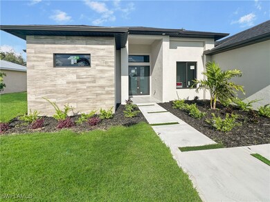 View of front of property featuring stone siding,