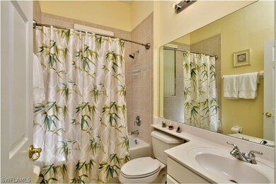 Guest bathroom is located between 2 guest bedrooms and is separated from the rest of the home by a pocket door for privacy