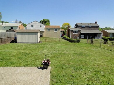Level rear yard with spacious shed...
