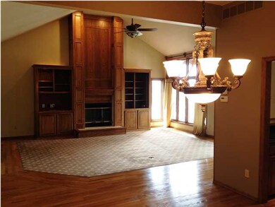 The vaulted great room enjoys natural light from t