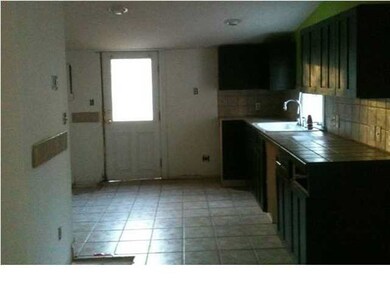 Kitchen with Dark wooden cabinets.
