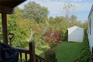 Nice, private sculptured, treed back yard and easy