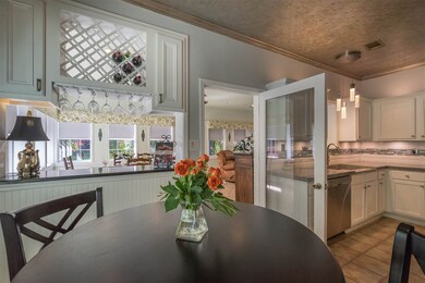Eat-in with plantation shutters, wine rack, storag
