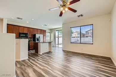 Kitchen with black appliances, luxury vinyl floors