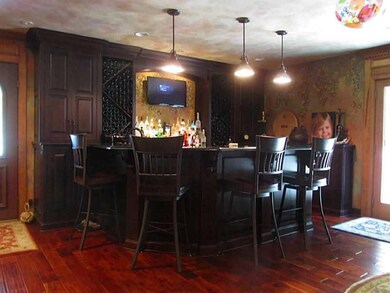 Great Room. Custom built cherry bar w/granite tops