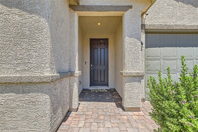 Doorway to property with stucco siding and a garag