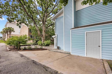 View of side of property with a patio