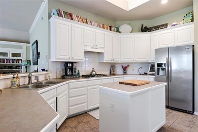 Kitchen featuring stainless steel appliances, whit