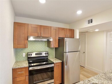 Kitchen with stainless steel appliances, under ca